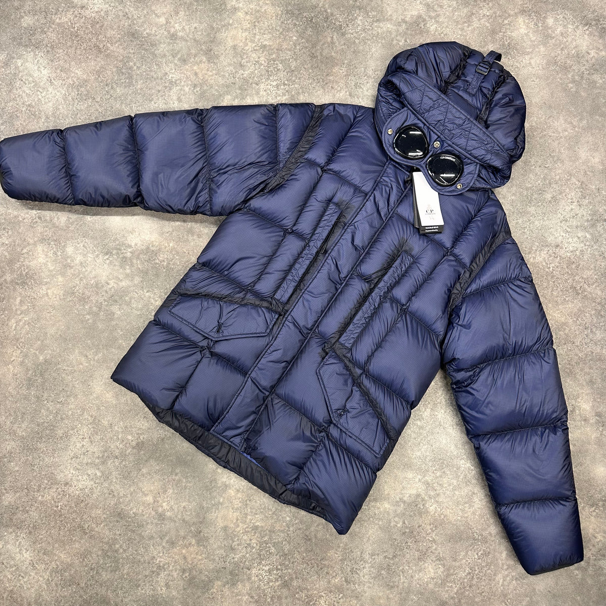 CP COMPANY DD SHELL GOGGLE HOODED PUFFER JACKET NAVY BLUE